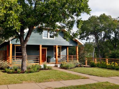 Dark Blue Home with Natural Wood Support Beams 