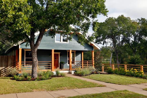 Dark Blue Home with Natural Wood Support Beams 