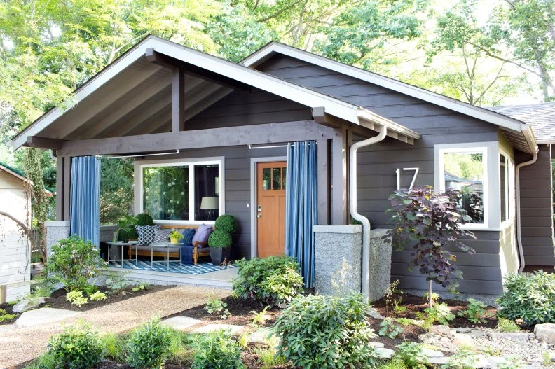Classic bungalow appeal with a modern twist and thoughtful landscaping gives this home a contemporary look that sets the stage for the rest of the home’s urban style. “The bungalow lifestyle is set back into nature and it’s cozy,” says interior designer Brian Patrick Flynn.