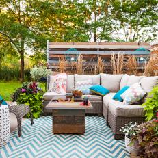 Decorated Outdoor Space with Cedar Table and Turquoise Lanterns