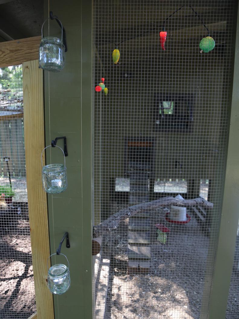 Crafty candle holders and a string of colored lights help create an easygoing atmosphere in their back yard chicken retreat. &quot;They are wonderful little blood-pressure-lowering creatures,&quot; says Bonnie of her eight birds.