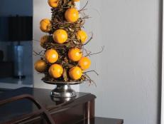 Add some fall flair to your home with this grapevine and clementine tree.