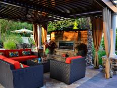 Designer Marc Nissim maximized space in this outdoor area, adding a dining space, fireplace and pond-like pool that are all optimal for entertaining.