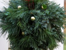 Snip some greenery from your yard and gardens and create a lovely kissing ball to welcome guests to your home for the holidays.