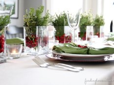<a target="_blank" href="http://findinghomeonline.com/christmas-decorating-ideas-holiday-housewalk-tour/">Finding Home</a> offers this beautiful, and easy way to create a holiday centerpiece, using glass  containers, fresh cranberries and sprigs of pine and boxwood.
