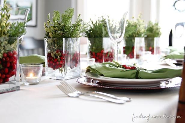 <a target="_blank" href="http://findinghomeonline.com/christmas-decorating-ideas-holiday-housewalk-tour/">Finding Home</a> offers this beautiful, and easy way to create a holiday centerpiece, using glass  containers, fresh cranberries and sprigs of pine and boxwood.