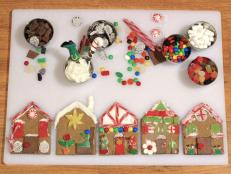 Kids can decorate these individual gingerbread house cookies as a DIY party favor this holiday season.