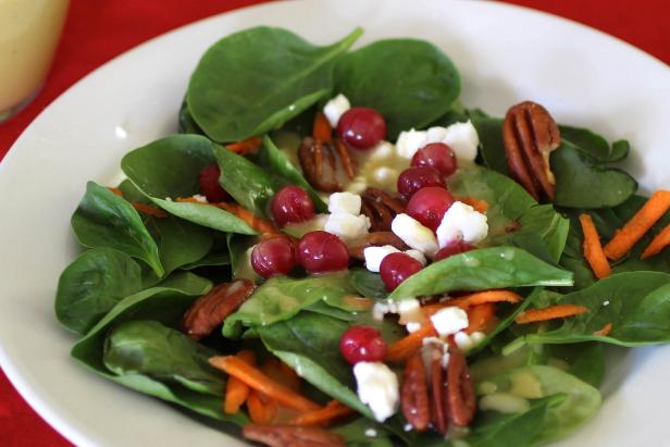 Spinach topped with pecans, cranberries and maple vinaigrette puts fresh salad back on the table this winter.