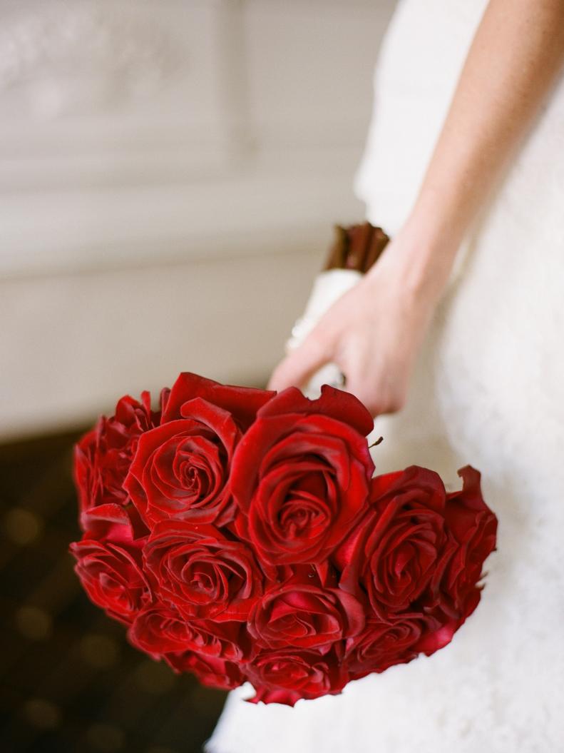 Red roses and greenery may feel too much like Christmas. Leave the leaves out for a simple and stunning bouquet.&nbsp;