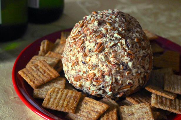 Nut-crusted cheese balls served with crackers are a favorite at holiday gatherings.