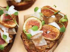 Fresh Kadota figs sit on a bed of caramelized onions in this seasonal crostini.