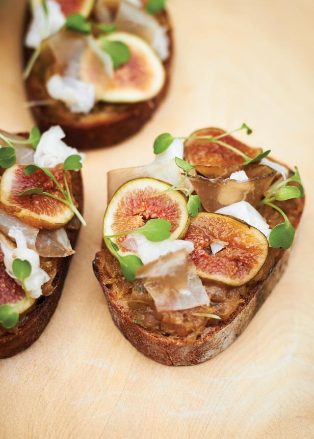 Fresh Kadota figs sit on a bed of caramelized onions in this seasonal crostini.