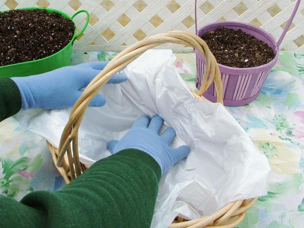 Lining a wicker basket with plastic
