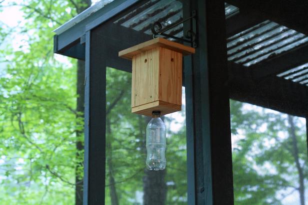 STEP TEN Add a hook or sting to the top for hanging purposes and thread bottle on to trap bottom. Hang securely along facia, in an area where carpenter bees have been seen previously. When trap is full, bottle may be discarded and replaced.