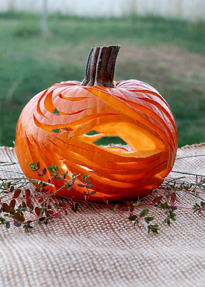 Undulating lines and flowing curves meet in this pumpkin to create a carving that is all about flowing shapes and gentle movement.