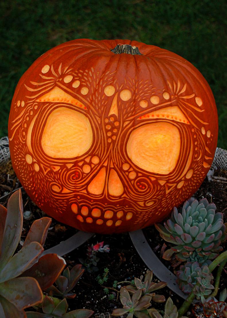 This decorative pumpkin skull captures the festive spirit of Dia de los Muertos - The Day of the Dead!