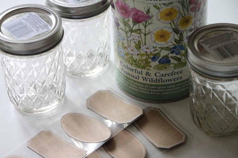 For these favors, you will need: jelly jars, burlap, wildflower seed mix, labels, scissors, felt, hot glue gun &amp; glue sticks, floral supply stamens, ribbon, computer, paper, computer printer, and garden twine
