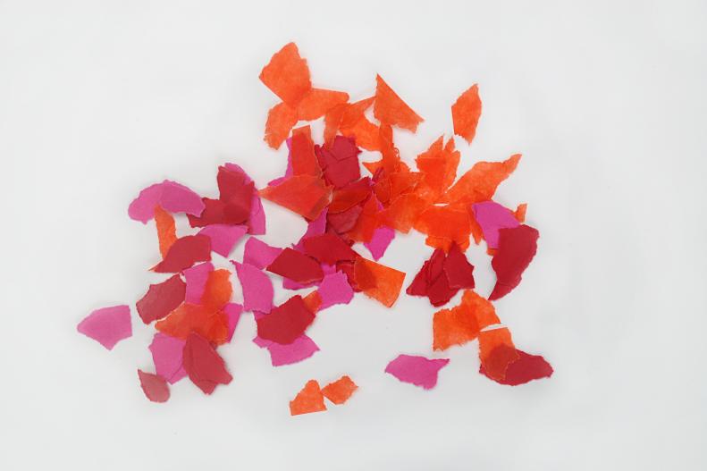 Begin by cutting or tearing your paper into small pieces. This is a great opportunity to put little ones who love cutting things to work. Two full sheets of cut up paper will make approximately 12 hearts, depending on size and thickness.
