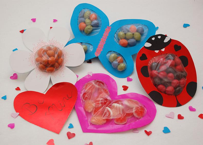 Spread a little love this Valentine's day with sweet, handmade cards. Create your favorite flower or garden love bug and fill with candy for a charming gifts. These are great Valentine's treats for kids or adults with a sweet tooth!
