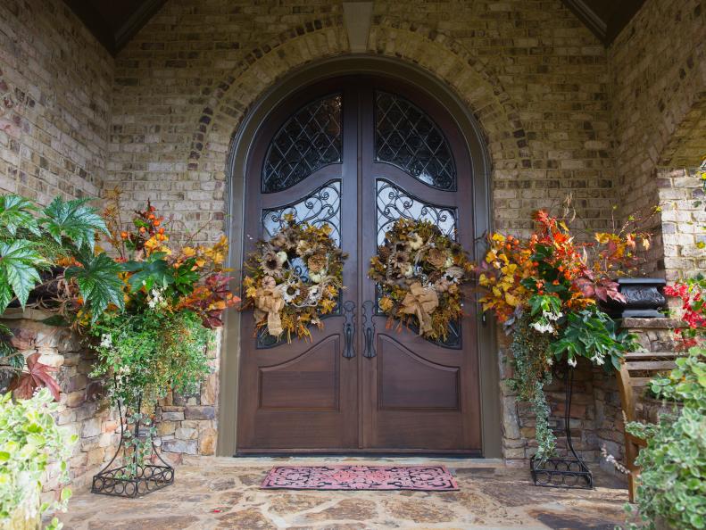 In fall, Addington accents year-round planters flanking her front door with fall foliage and twigs.