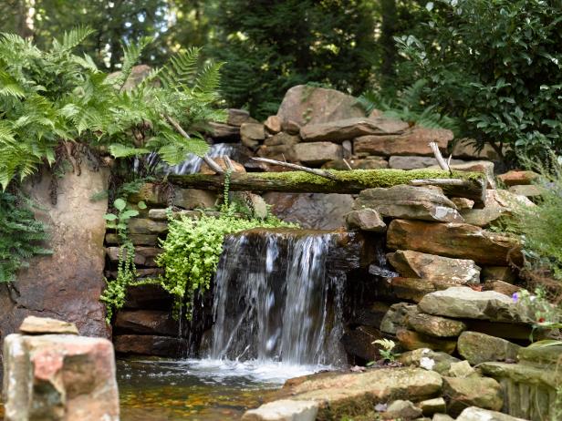The waterfall is inspired by those along scenic U.S. Hwy. 64 near Highlands, N.C. Truckloads of stone were brought in from Tennessee, with extra details including a moss-covered log from north Georgia. Creeping Jenny has grown into the waterfall, which was built by Mountain Scapes of Clayton, Ga., and is surrounded by ferns from North Carolina.
