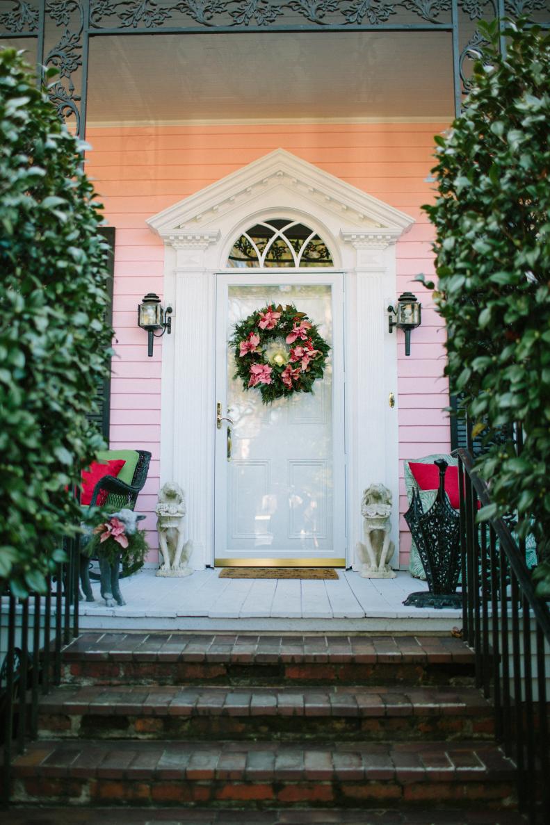 When hosting guests for the holidays, Karin Jeffcoat of <a target="_blank" href="http://www.cotedesignsevents.com/#%21/HOME">Cote Designs</a> says it's important to consider the feel and ambiance of each part of your home, starting with the front porch. She used poinsettias in wreaths and for other special touches to put together a beautiful and creative creation to wow guests upon arrival.