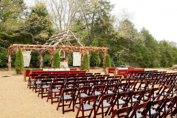 Day or night, the handmade red cedar arbor at Green Door Gourmet in Nashville, Tennessee, makes an unforgettable backdrop to a beautiful outdoor wedding.