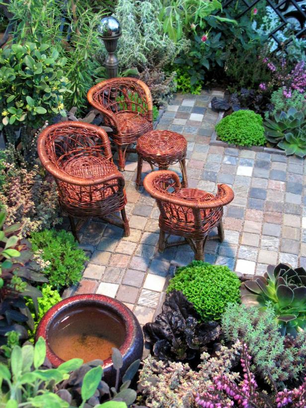 Cottage gardens share several design elements, including a small lawn or paved area and seating, lots of garden accessories, and a feeling of enclosure.