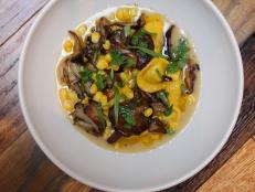 Mushrooms add an earthy flavor to this creamy broth, which is flavored with Parmesan rind, sweet corn and freshly picked tarragon.&nbsp;