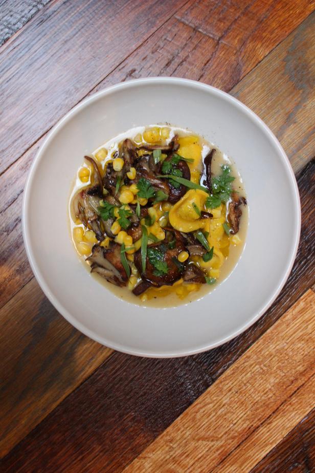 Mushrooms add an earthy flavor to this creamy broth, which is flavored with Parmesan rind, sweet corn and freshly picked tarragon.&nbsp;