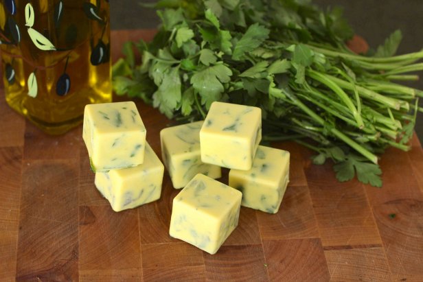 Olive oil or butter helps to retain the potency of fresh herbs in the freezer.