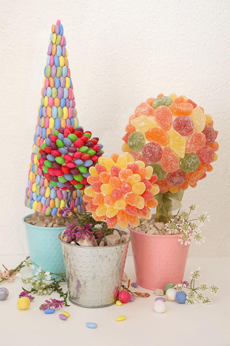 This Easter turn your favorite Easter candies into cute topiaries. With just a few simple Styrofoam shapes and some homemade icing you can make these charming, edible centerpieces.