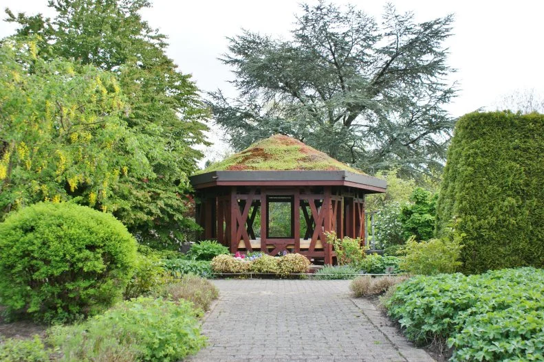 Similar in style to sod-roof houses, this gazebo with a living carpet on top blends in with its green surroundings at the Botanischer Garten Universitat Hamburg (Germany).