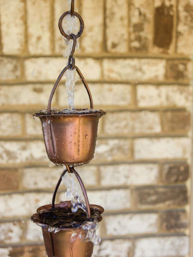 Add some decorative and useful charm to your home. A rain chain will replace a traditional downspout and excess water away from your home.