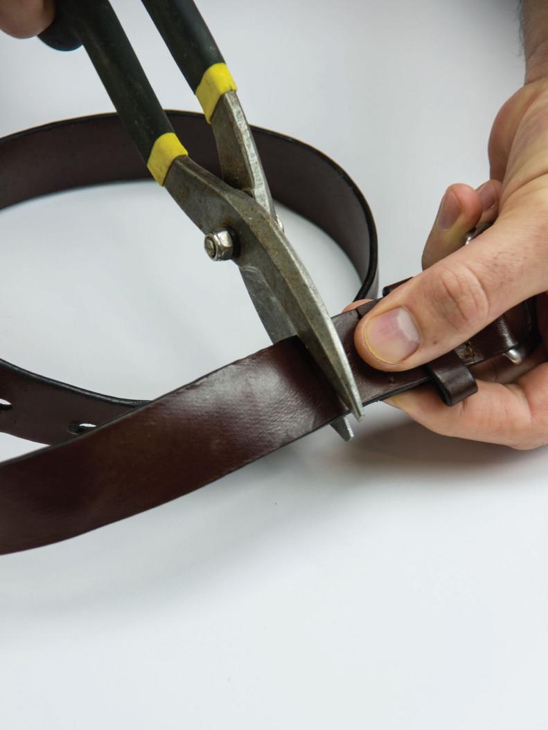 Begin by cutting the buckles and holes from the belts with tin shears. Cut one of the belts 19&quot; long for the handle. Set aside.