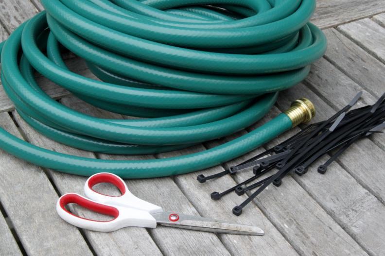 For this project you will need: Scissors/50 foot garden hose-100 eight inch zip ties