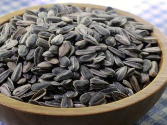Harvest sunflower seeds for a nutritious snack straight from the back yard.
