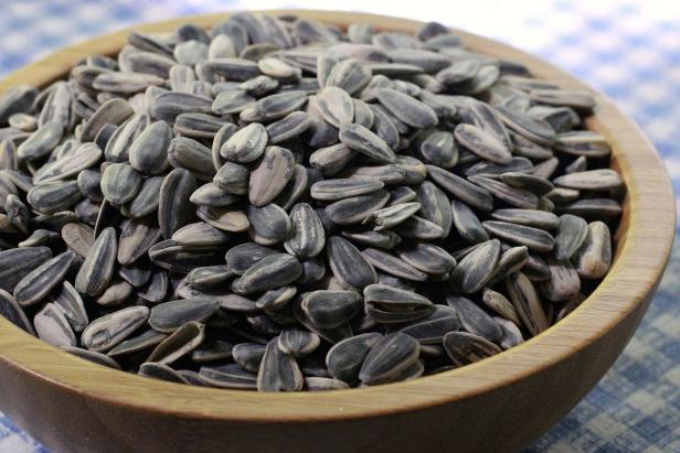 Harvest sunflower seeds for a nutritious snack straight from the back yard.