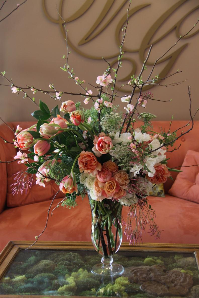 Birkicht sources from local flower markets, nurseries and craft stores for her arrangements, like this spring-inspired spread of French tulips, coral quince branches, white sweet pea, Queen Anne’s lace and garden roses.