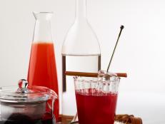 Made with hibiscus tea and rhubarb poaching liquid, the Spring Forward Cocktail has a deep red color.&nbsp;