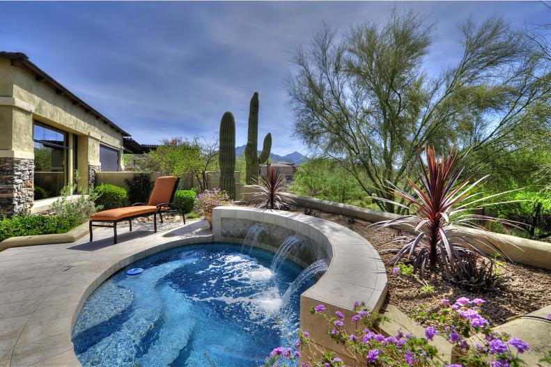 Life on the prairie might have been tough for the first settlers but how times have changed. This contemporary Arizona home comes with a private spa with a fountain and pool decking made of travertine stone tile, courtesy of the Matheson Team. The surface inside the pool is a glazed ceramic tile.&nbsp;