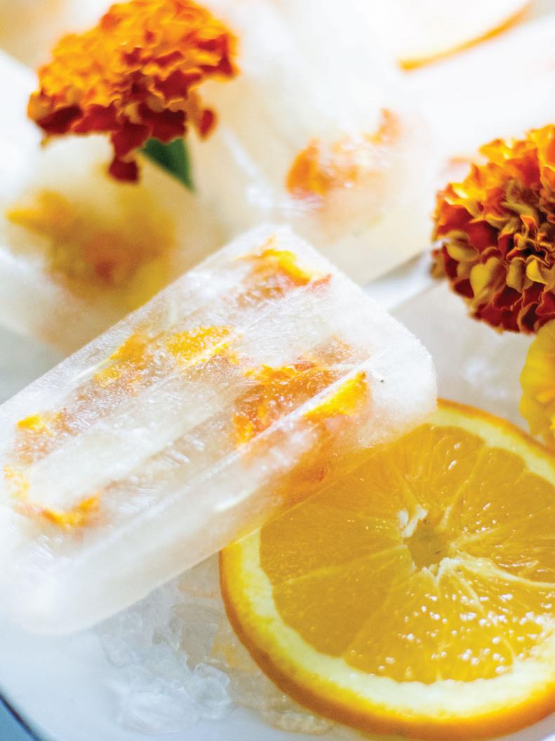 These edible petal marigold and citrus popsicles would be perfect for a summer picnic.