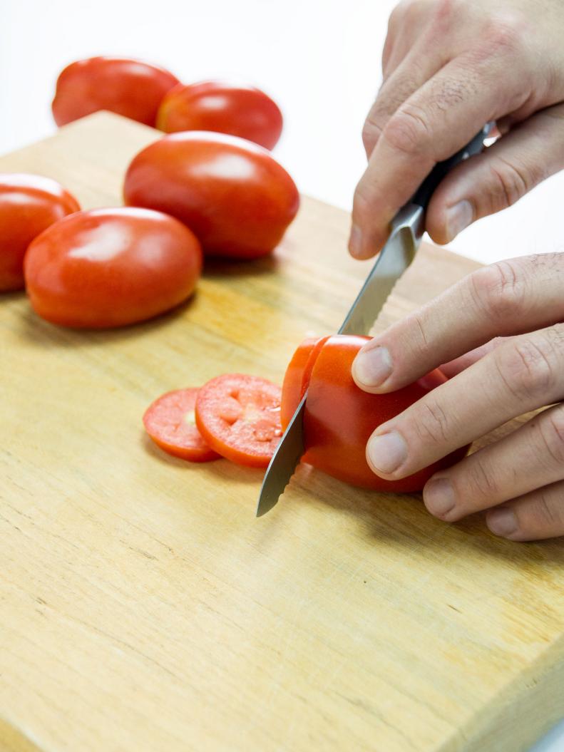 Cutting the tomatoes