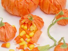 These sweet party favors are simple to create and so fun to share! They're easy enough for kids to make, but children and grow ups will both enjoy tearing open this little pumpkins to find the sweet treats inside. Make them for your next Fall or Halloween party and send them home as little gifts!
