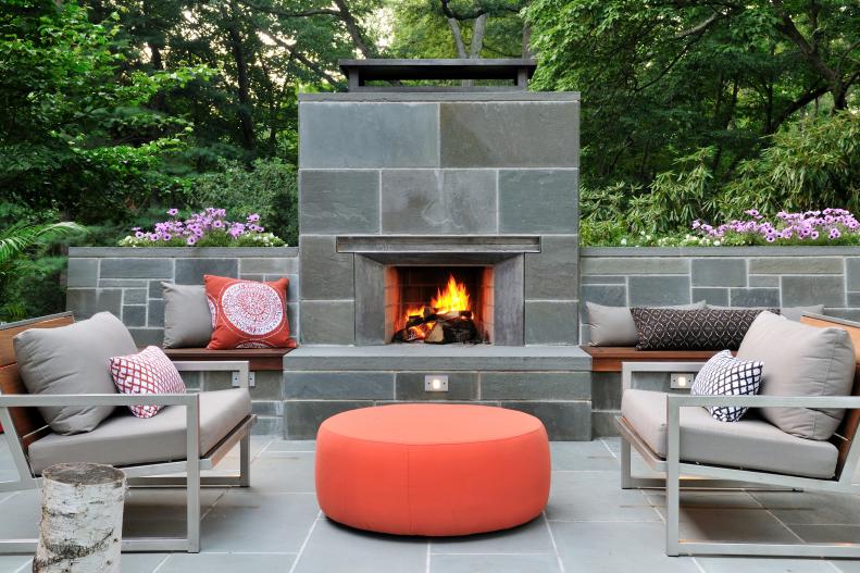 The home and outdoor area were remodeled to maximize its location on the fringe of a nature preserve in Massachusetts, says Mark Lawton, director of architecture and design for Ikaria Living. The backyard previously was only grass, but the homeowners now use it often, even for a recent backyard wedding. The bluestone seats are topped with ipe wood, and planters are built into the top of the seatback walls. The furniture is from Room &amp; Board; pillows are by local artisans. <a target="_blank" href="http://www.ikarialiving.com">ikarialiving.com</a>