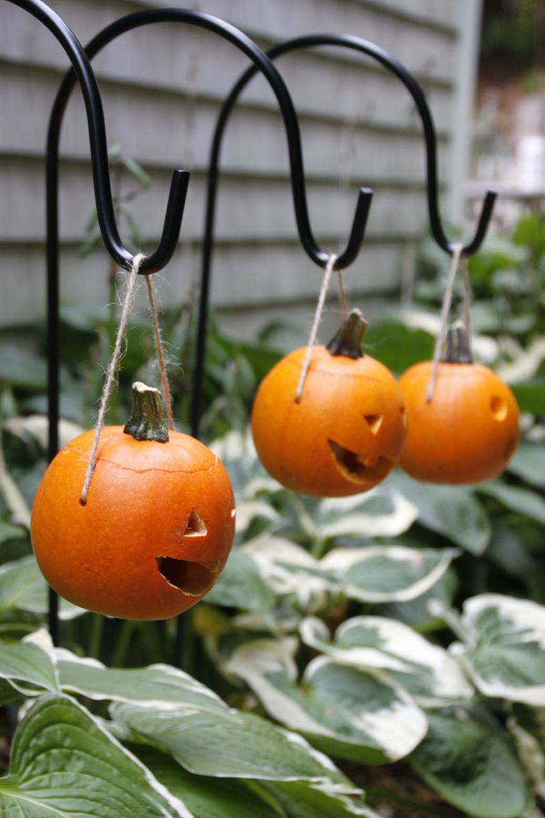 Light up your walkway or garden path with these adorable pumpkin lanterns