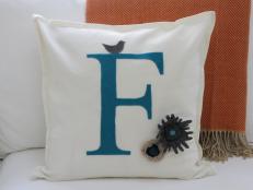 Turn an ordinary pillow into a lovely personalized pillow complete with felted flowers.