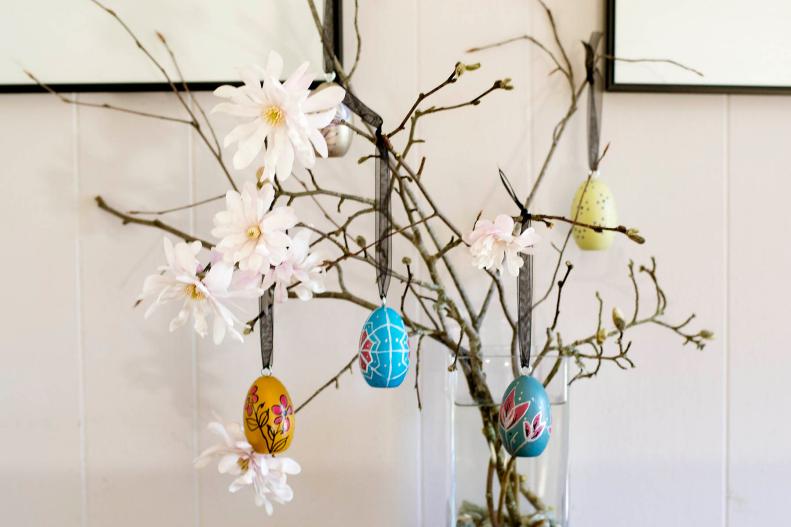 Decorated Wooden Eggs Hanging on Branches