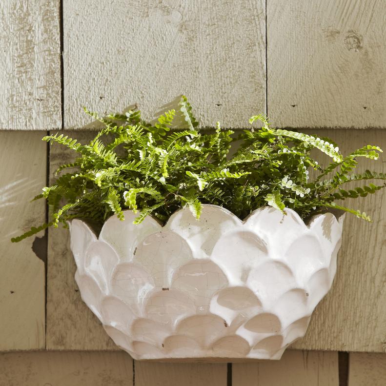 &quot;Whether you’re looking for a small-space solution, or a way to landscape your garden from head-to-toe, wall planters are a fun way to infuse your backyard space with plants at all angles.&quot;