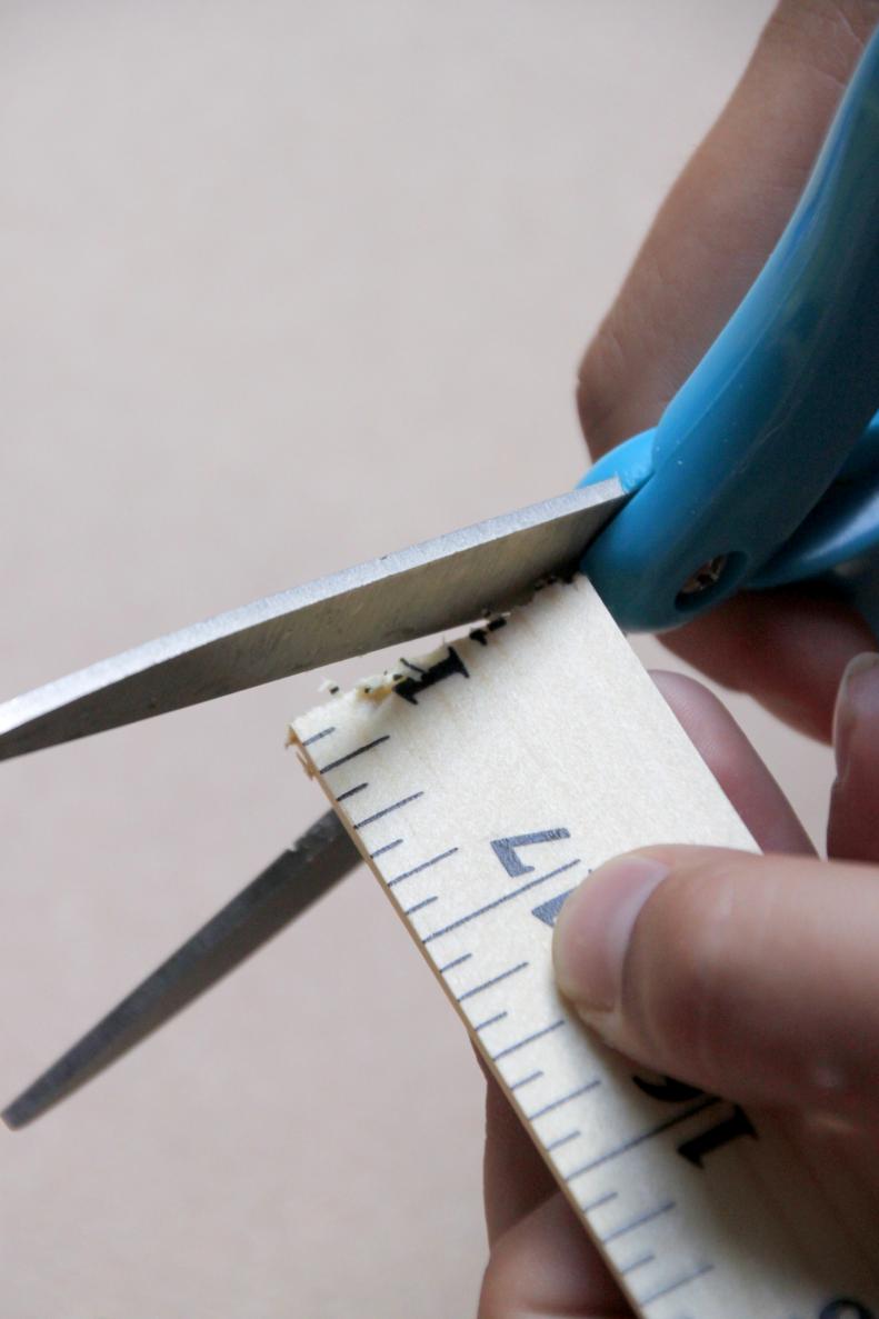 With the scissors, trim up the rough ends of the ruler sections if necessary and set them aside.